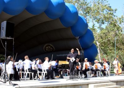 The SoCal Philharmonic performs on stage.