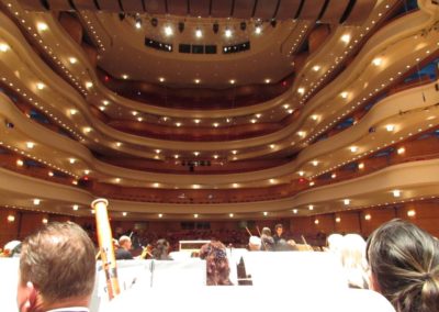The inside of a large auditorium hosting the SoCal Philharmonic.